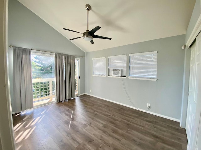 unfurnished bedroom featuring lofted ceiling, ceiling fan, dark wood-type flooring, and baseboards