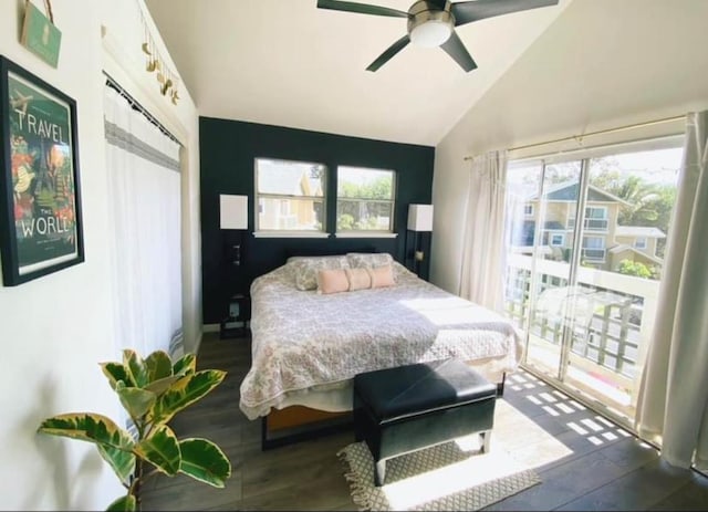 bedroom with vaulted ceiling, access to outside, dark wood-style flooring, and a ceiling fan