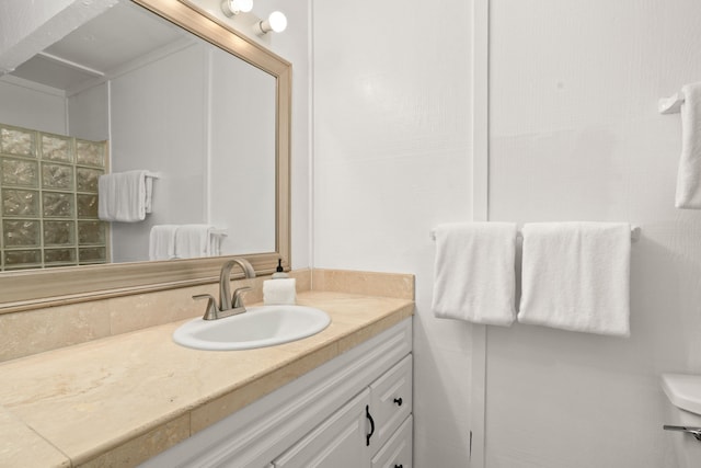 bathroom with vanity and toilet