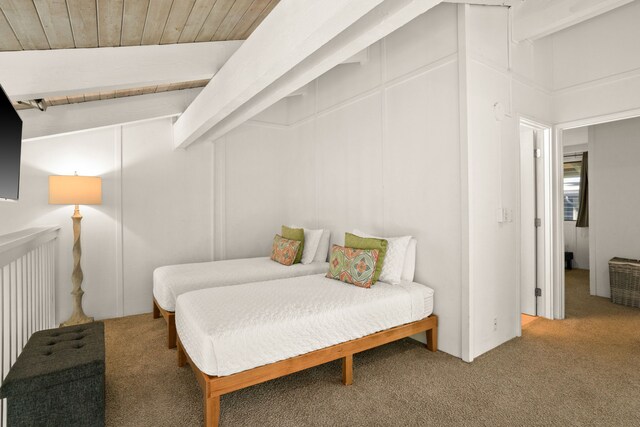 bedroom with lofted ceiling, carpet flooring, and wood ceiling