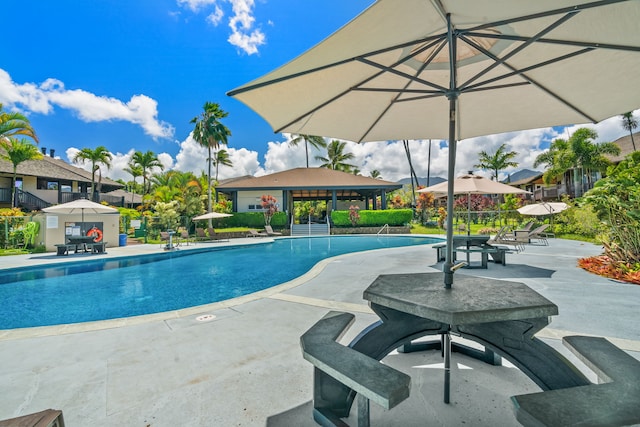 view of swimming pool with a patio area and a gazebo