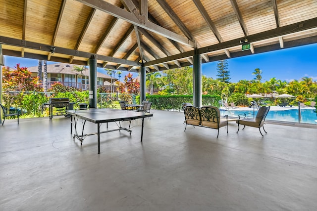 view of patio / terrace featuring a community pool and a gazebo