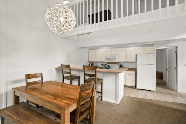 view of carpeted dining area