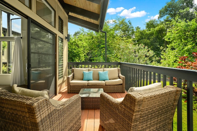 wooden deck featuring an outdoor hangout area