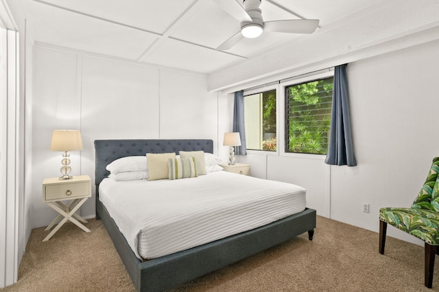 bedroom with ceiling fan and carpet floors