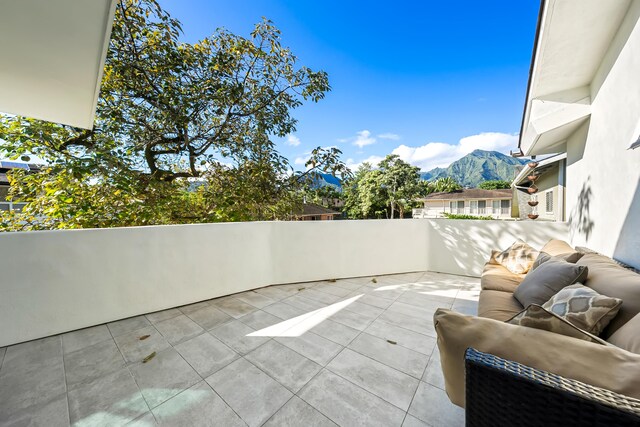 view of patio / terrace with a mountain view