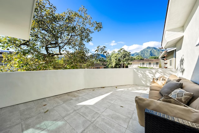 view of patio / terrace featuring a mountain view