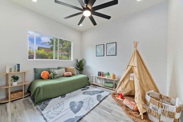 bedroom featuring hardwood / wood-style floors and ceiling fan