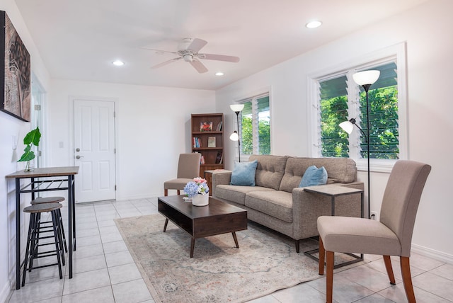 living room with ceiling fan and light tile patterned flooring