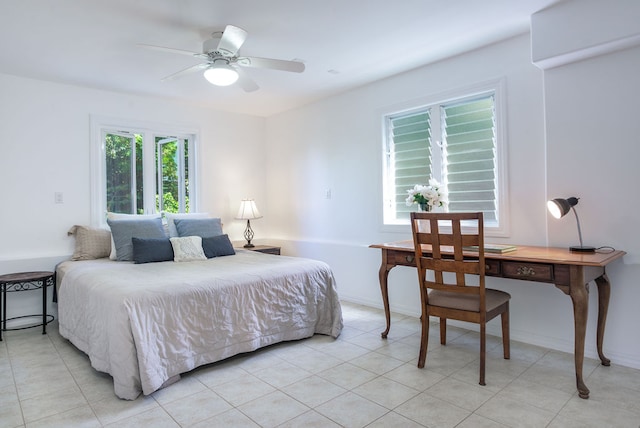 tiled bedroom featuring ceiling fan