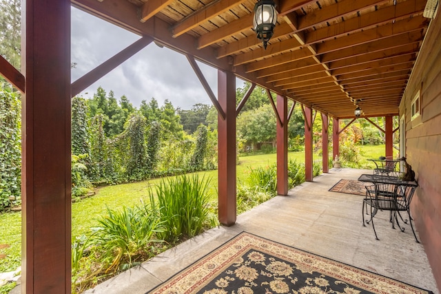 view of patio featuring ceiling fan