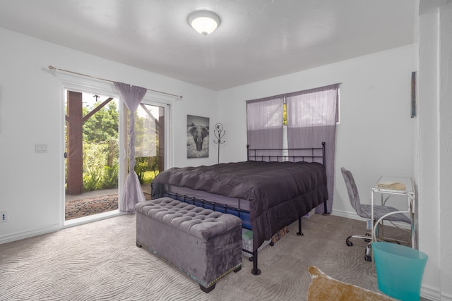 bedroom featuring carpet floors and access to outside