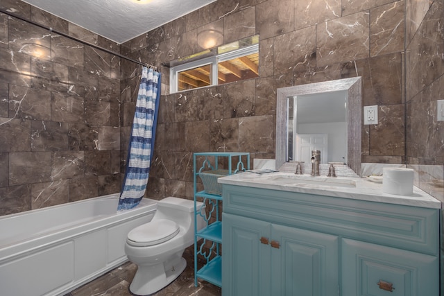 full bathroom featuring toilet, vanity, tile walls, a textured ceiling, and shower / bathtub combination with curtain