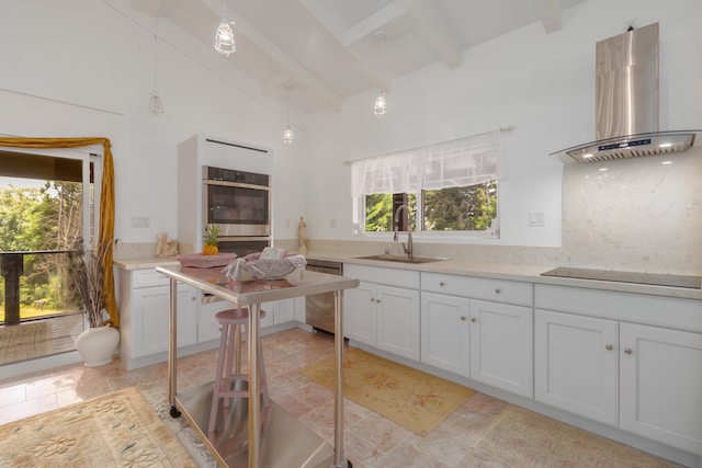 kitchen featuring sink, beam ceiling, range hood, light tile patterned floors, and stainless steel appliances