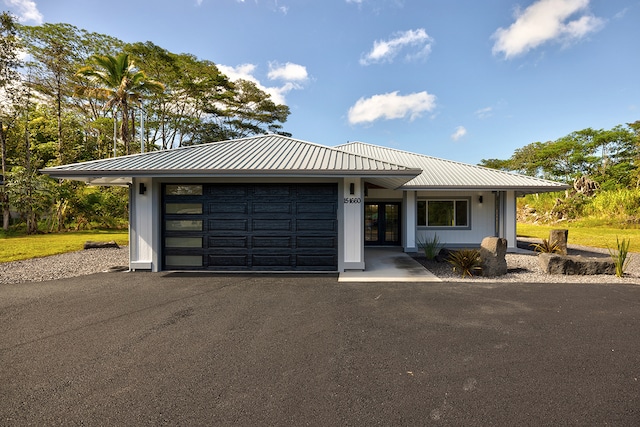 view of front of property with a garage