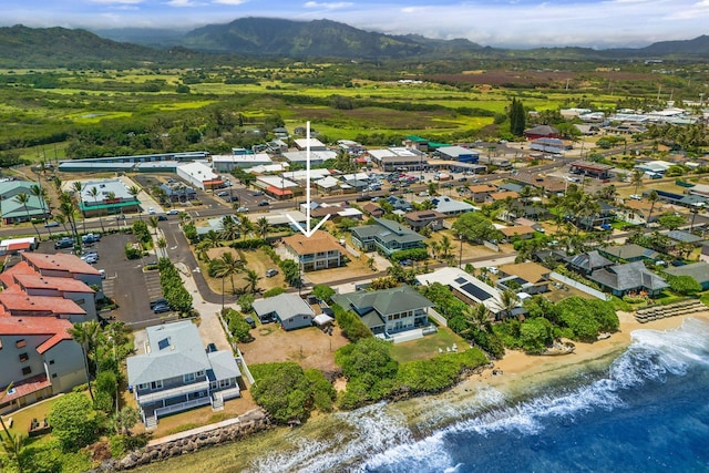 birds eye view of property featuring a water and mountain view