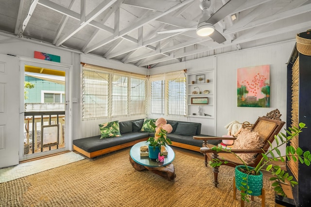 sunroom featuring lofted ceiling and ceiling fan