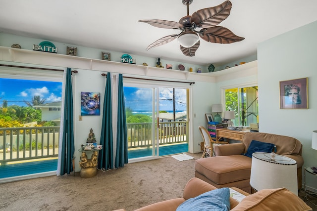 carpeted living room featuring ceiling fan