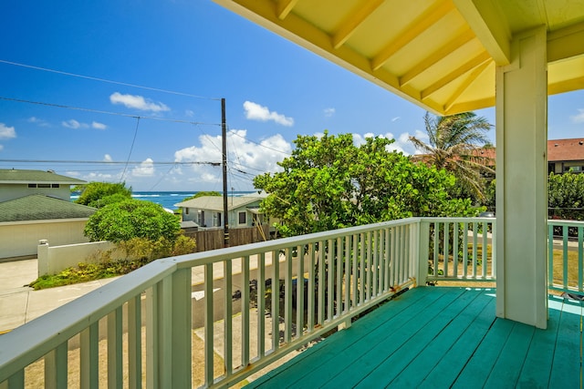 wooden terrace featuring a water view