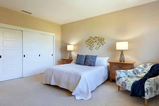 carpeted bedroom with a closet