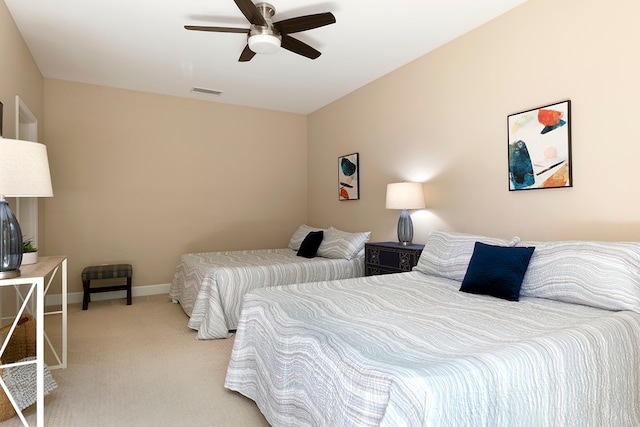 bedroom featuring ceiling fan and light colored carpet