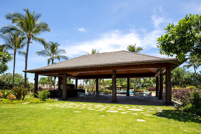 view of home's community with a patio area, a gazebo, and a yard