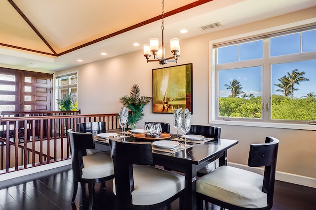 dining space with an inviting chandelier and dark wood-type flooring