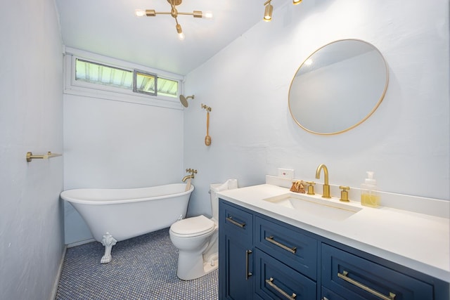 bathroom with a bathing tub, tile patterned flooring, vanity, and toilet