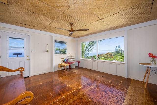 interior space featuring ceiling fan and dark hardwood / wood-style floors