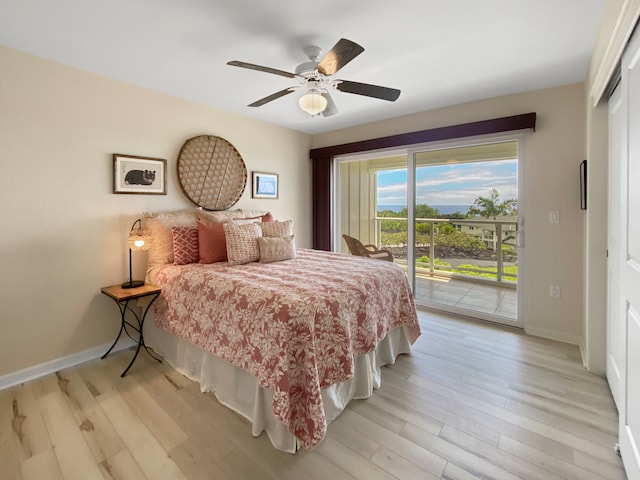 bedroom featuring light hardwood / wood-style floors, ceiling fan, and access to exterior