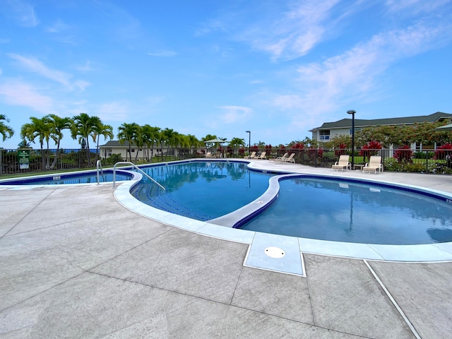 view of swimming pool with a patio area