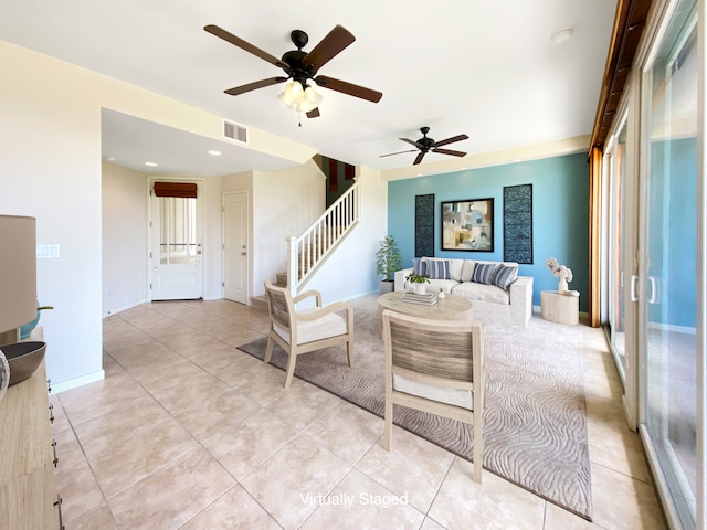 tiled living room with ceiling fan