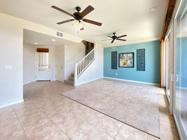 unfurnished living room with ceiling fan and light tile patterned floors