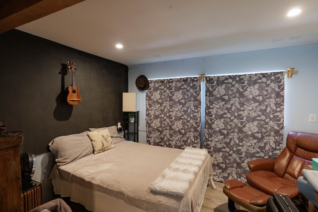 bedroom with wood-type flooring