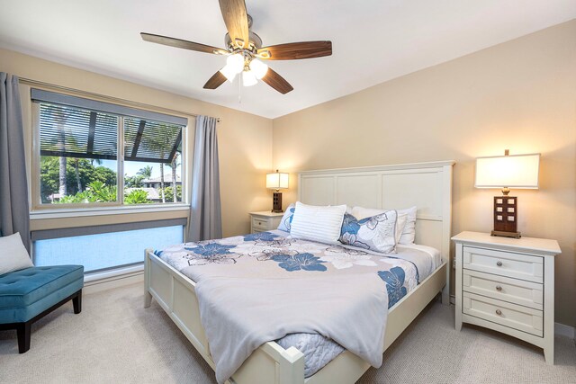 bedroom with light colored carpet and ceiling fan