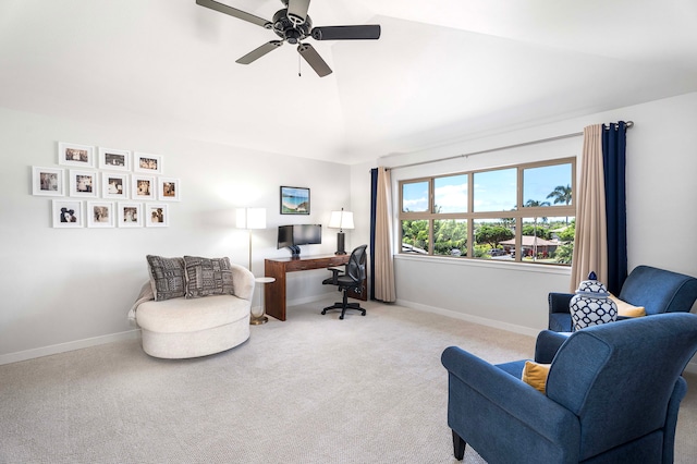 carpeted home office with vaulted ceiling and ceiling fan