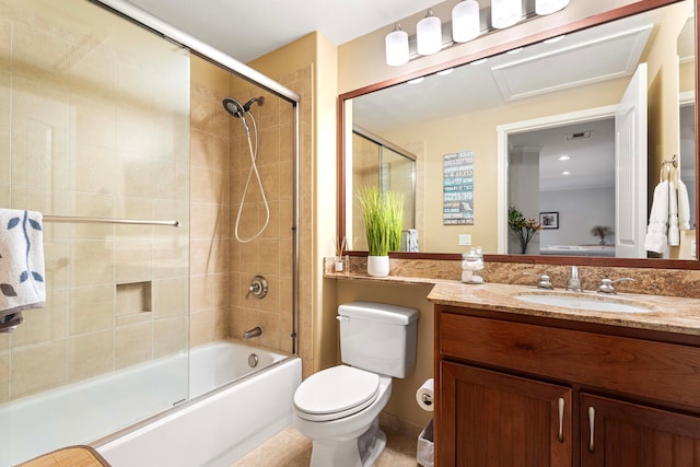 full bathroom featuring shower / bath combination with glass door, vanity, and toilet