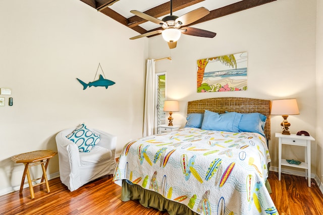 bedroom featuring vaulted ceiling with beams, ceiling fan, and dark hardwood / wood-style flooring