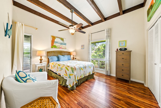 bedroom featuring beamed ceiling, ceiling fan, dark hardwood / wood-style floors, and a closet