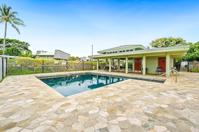 view of swimming pool with a patio area