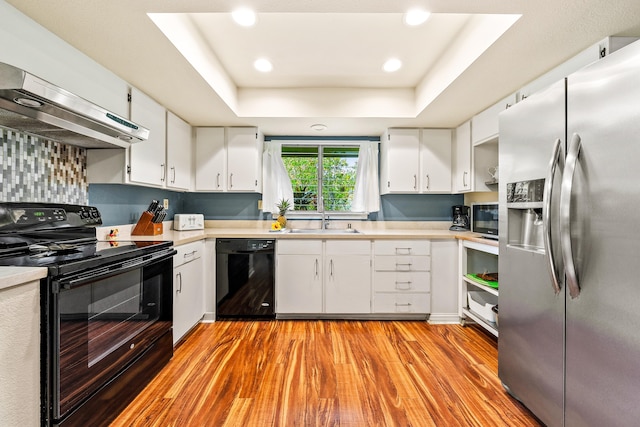 3880 Wyllie Rd Unit 26A, Princeville, HI 96722 - kitchen featuring black appliances, under cabinet range hood, a sink, light countertops, and recessed lighting
