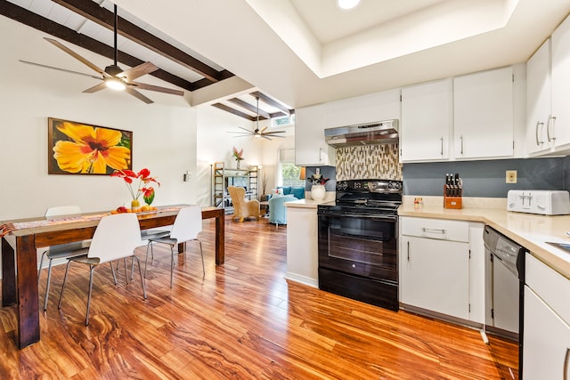 kitchen featuring black appliances, beamed ceiling, light hardwood / wood-style floors, white cabinetry, and extractor fan