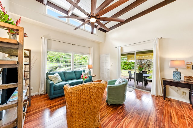 living room featuring beamed ceiling, high vaulted ceiling, ceiling fan, and dark wood-type flooring