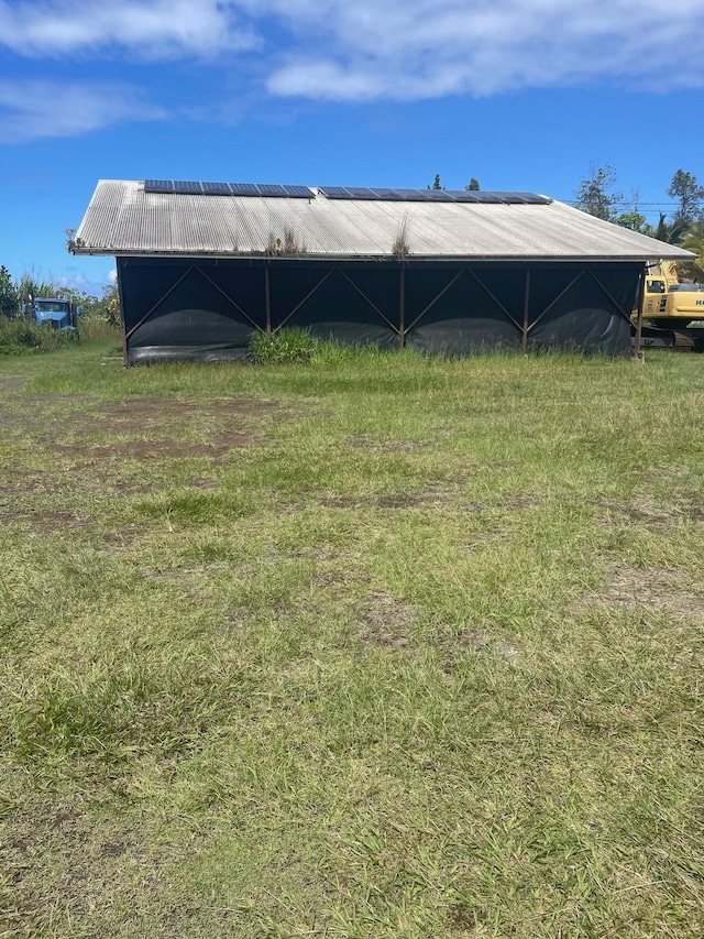 exterior space with a pole building and an outbuilding