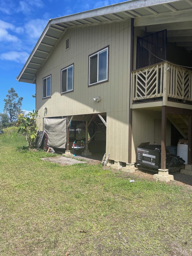 back of house with a yard