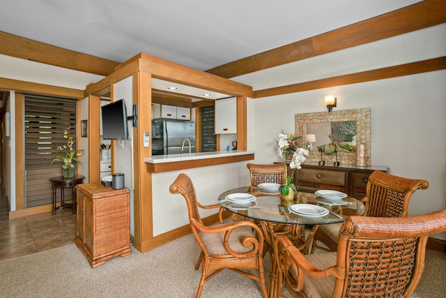 view of carpeted dining space