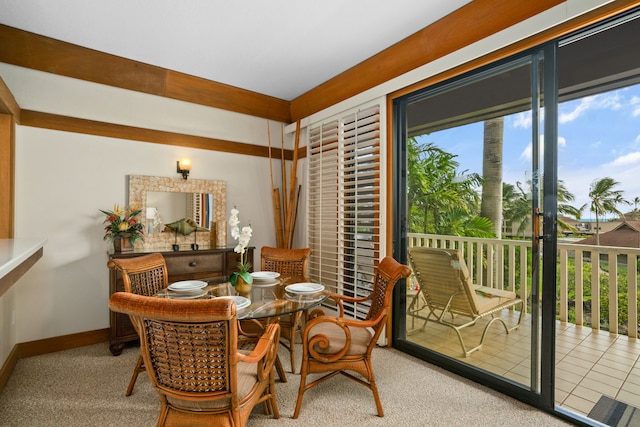 dining room with plenty of natural light and light carpet