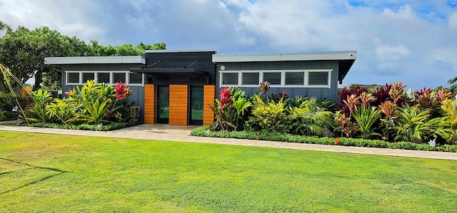 contemporary house with a front yard