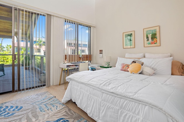 bedroom with carpet and access to outside