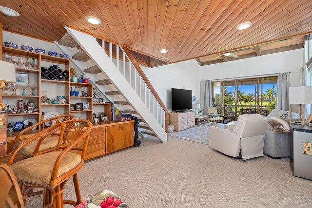 carpeted living room with stairway, wooden ceiling, and recessed lighting